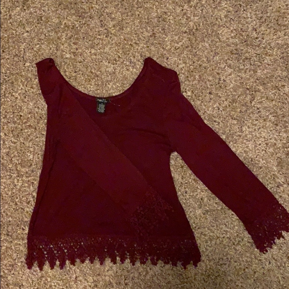 Maroon colored scoop neck shirt.